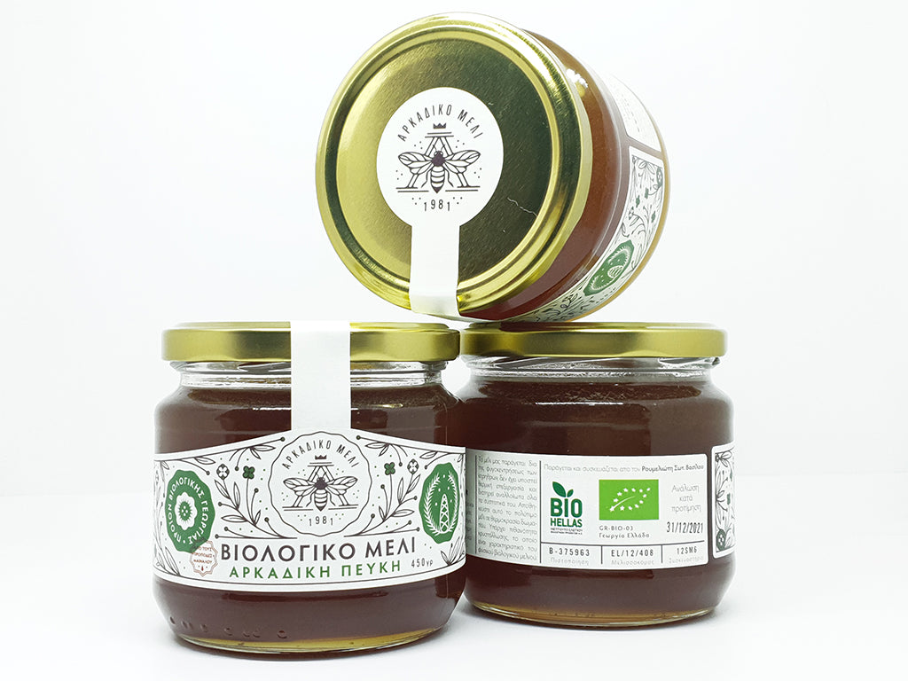 Organic pine honey 450g close-up Greek pine honey jar label and texture